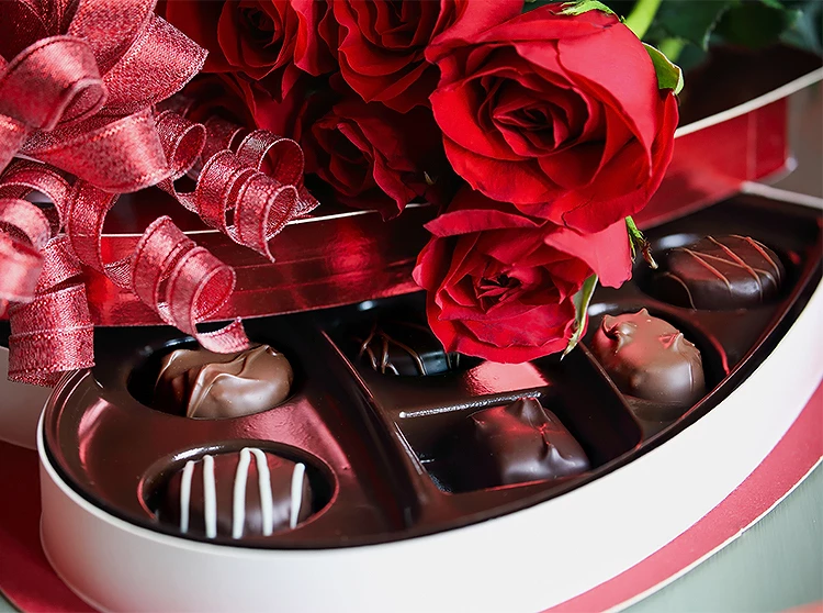 a box of chocolates and roses