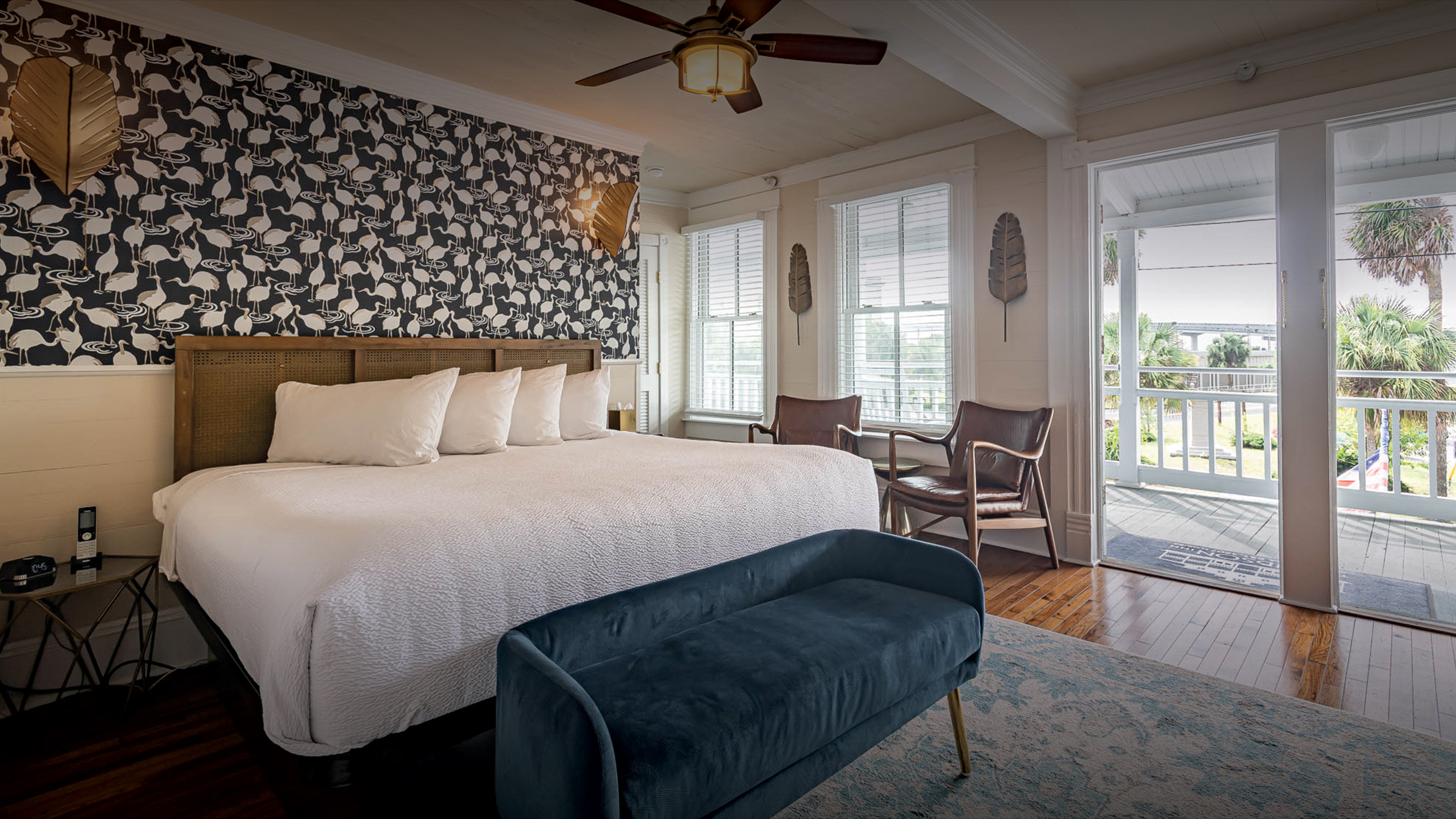 a bedroom with a bed and a fan