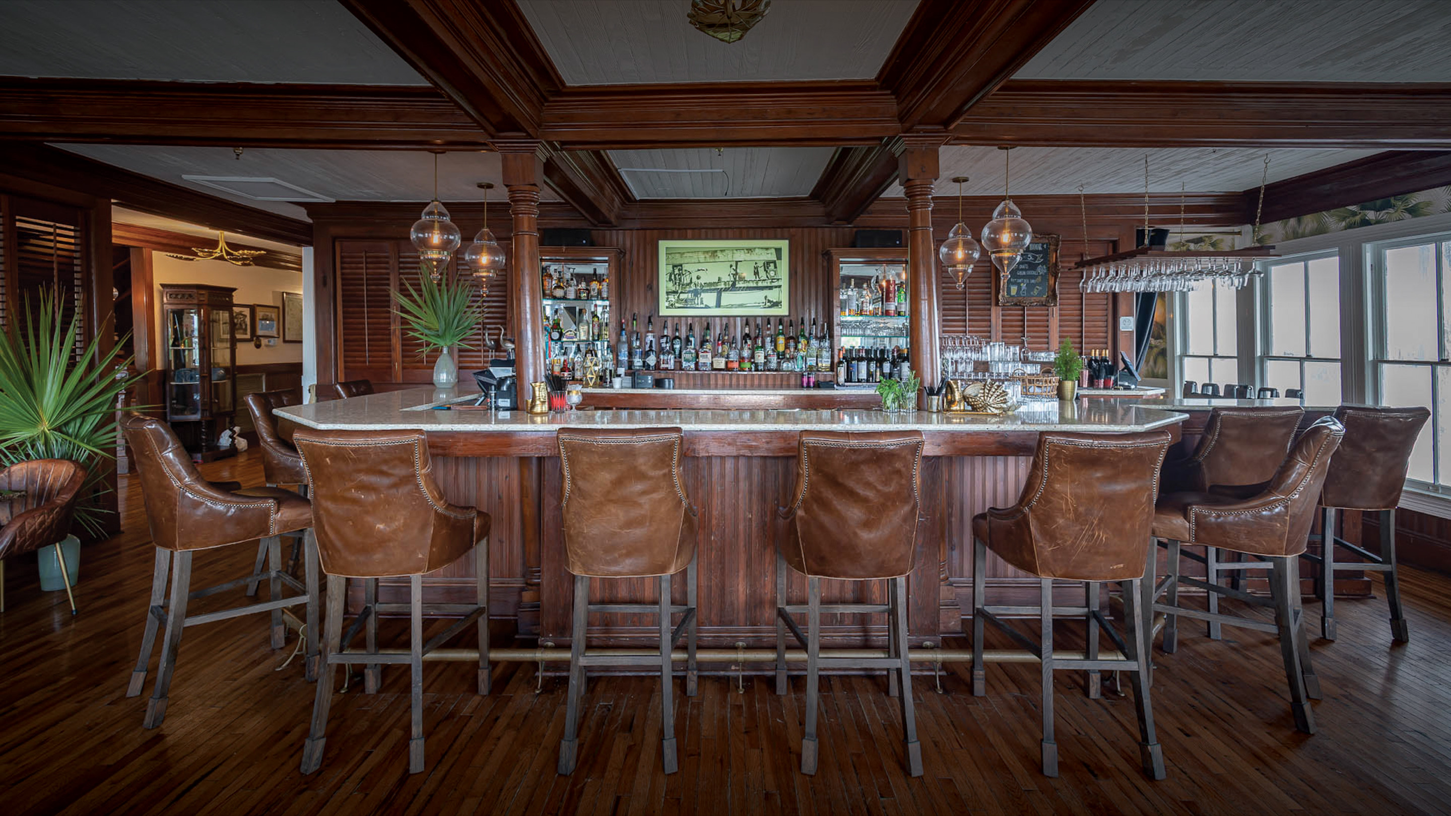 a bar with chairs around it