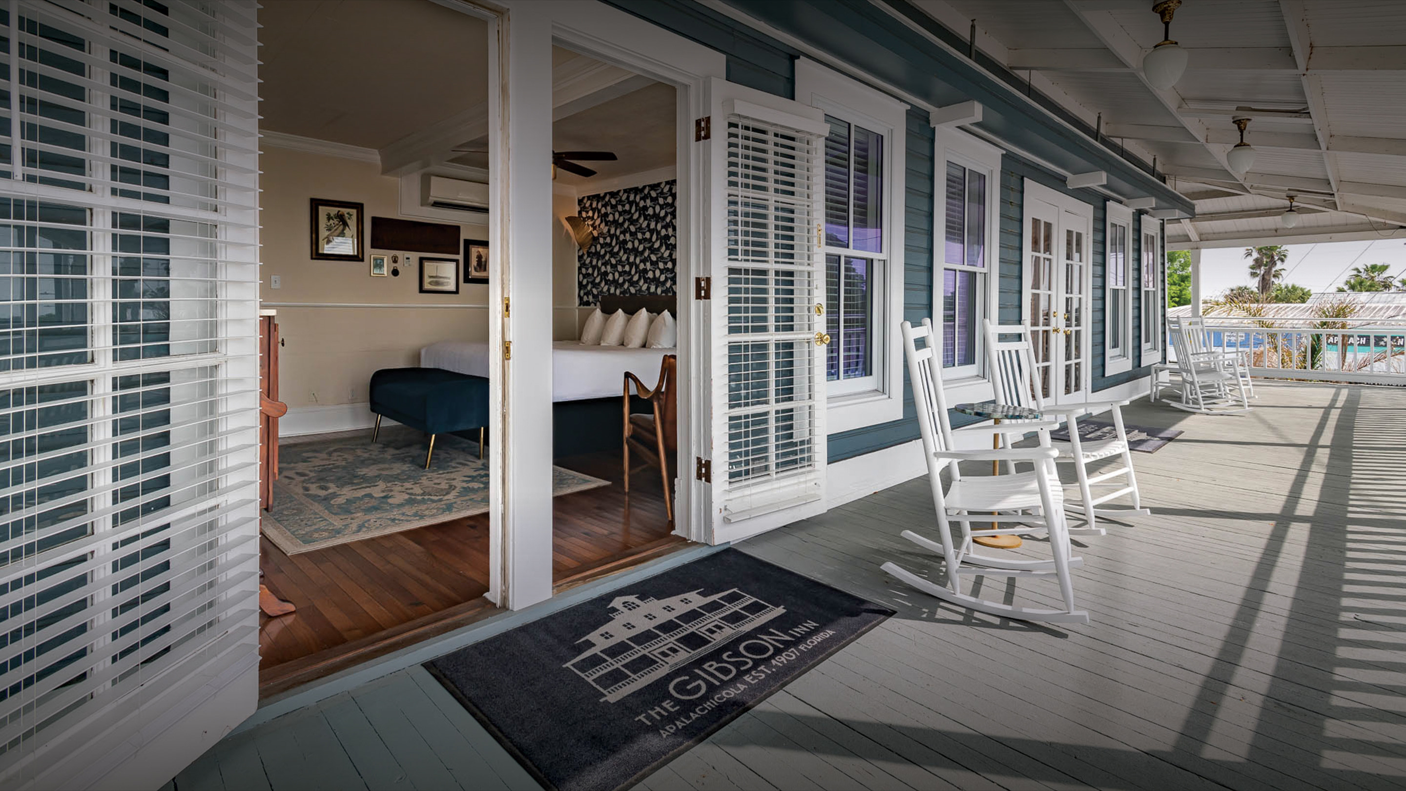 a room with a table chairs and a rug