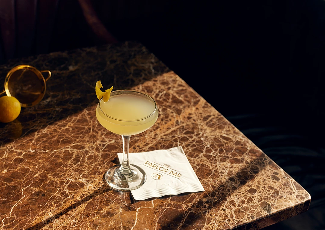 a glass of champagne on a table