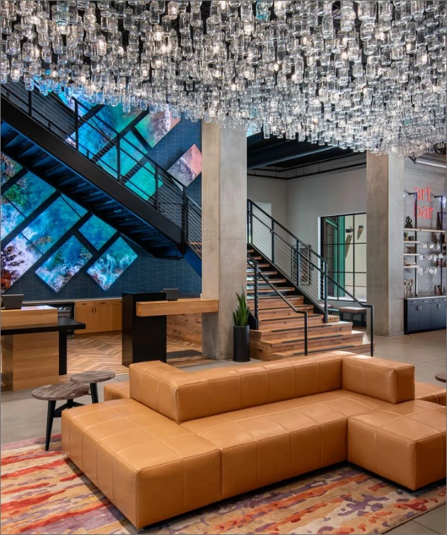 a room with a chandelier and couch