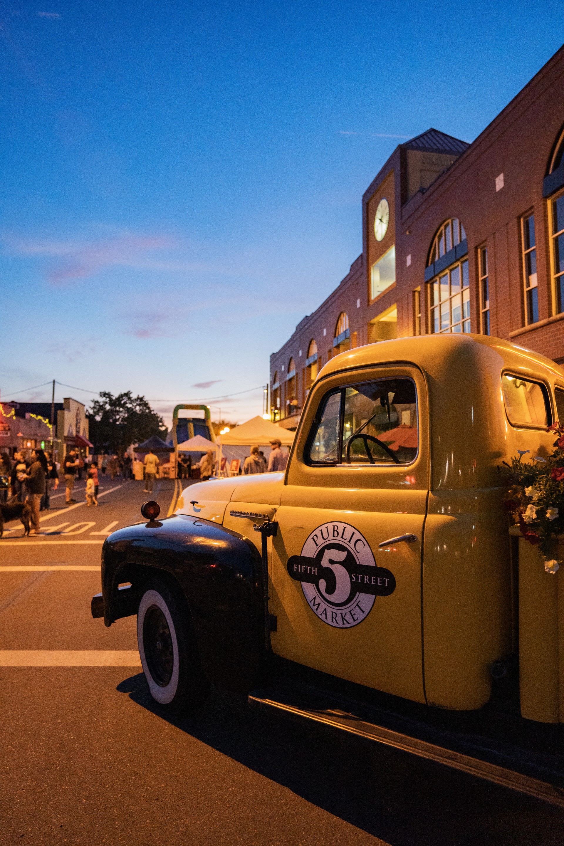 a yellow truck parked on a street
