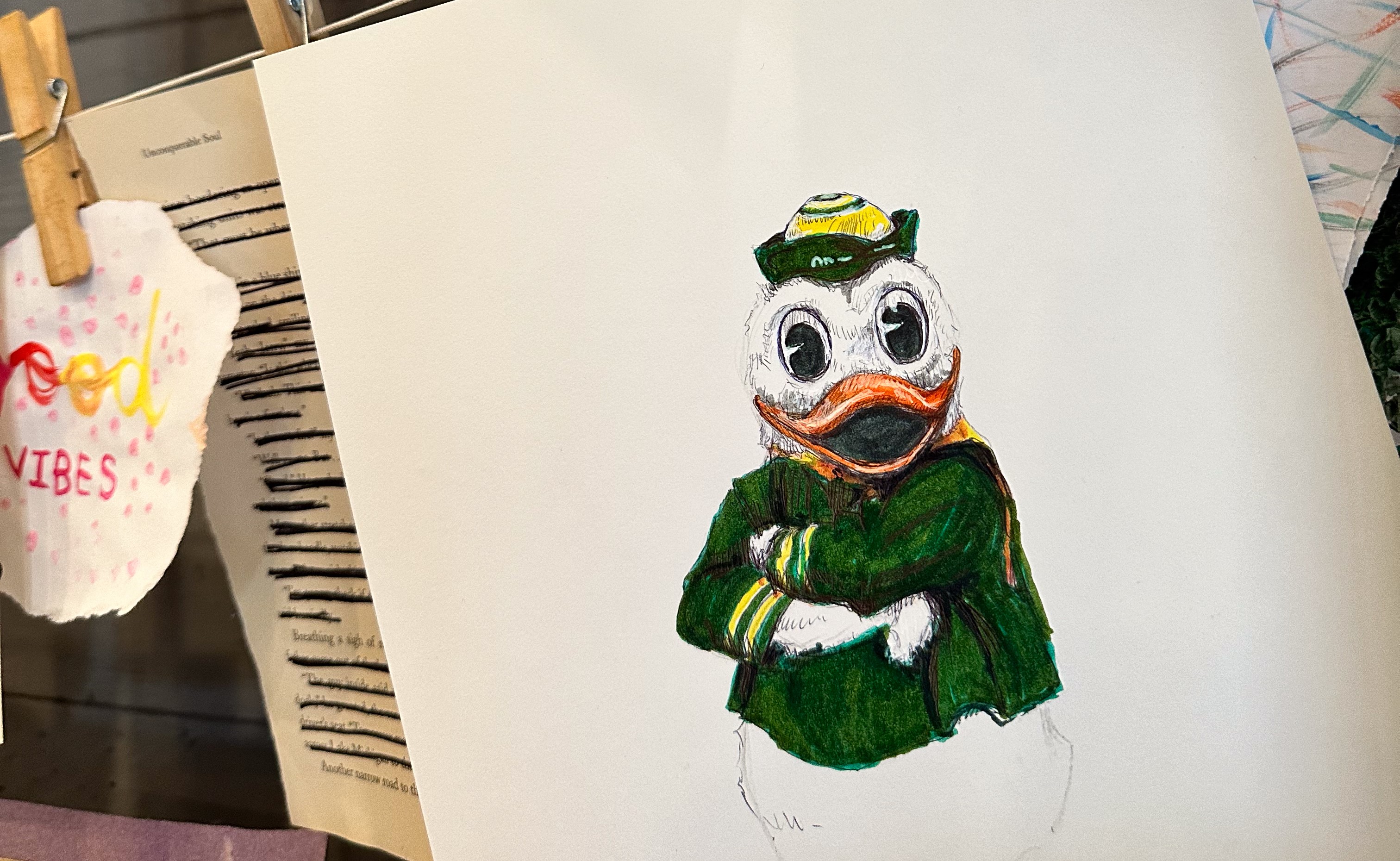 a drawing of a duck wearing a green uniform