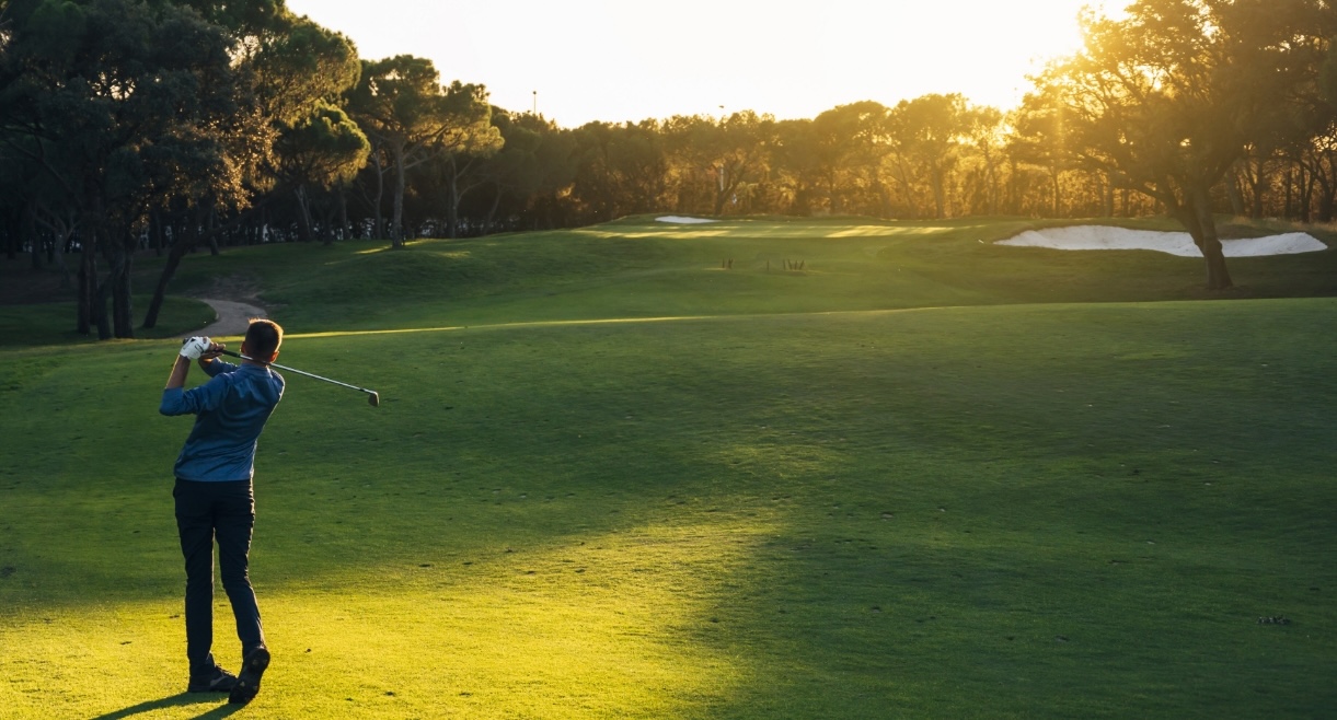 a person playing golf on a golf course
