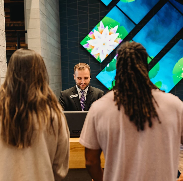 a person speaking to a group of people