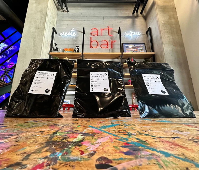 a group of black bags on a table