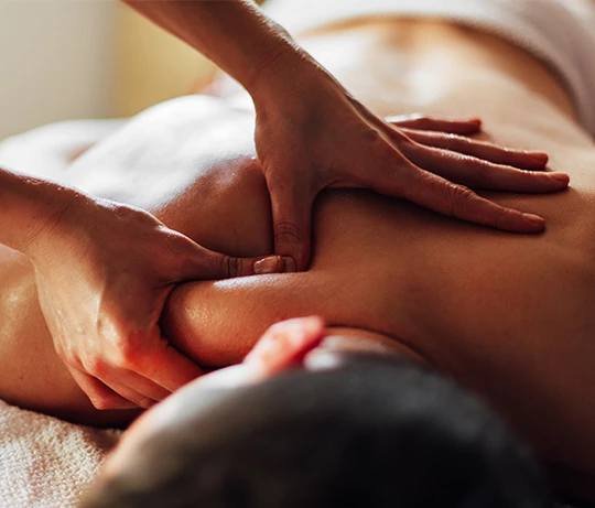 a person receiving a back massage