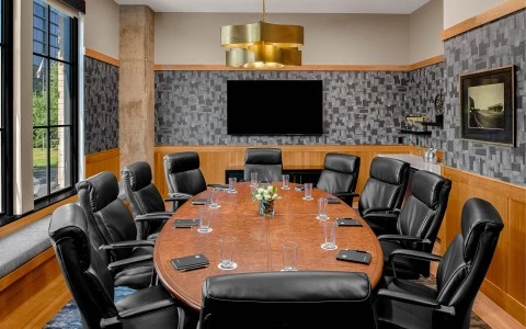 a conference room table with chairs 