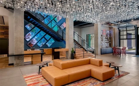 a room with a couch and a staircase