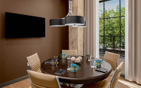 a round table with four chairs