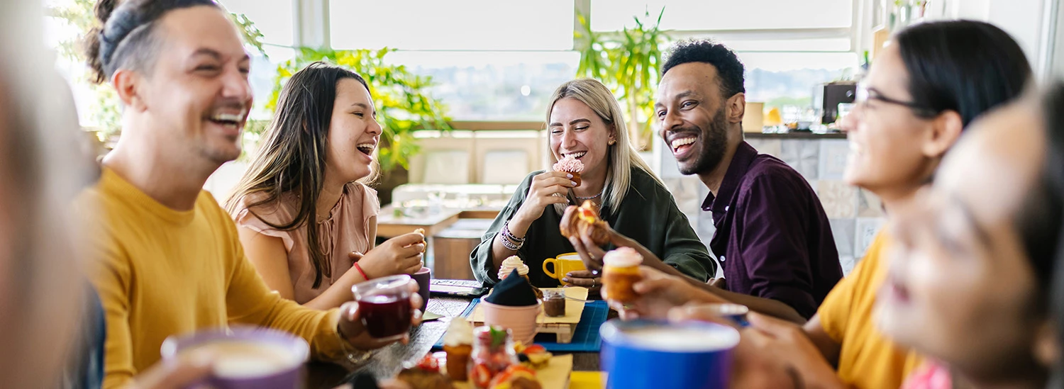 a group of people sitting around a table