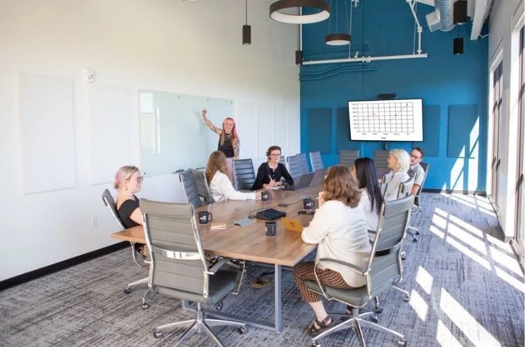 a group of people sitting around a table