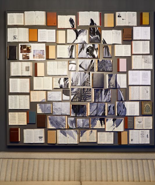 horse picture on the wall on top of couch