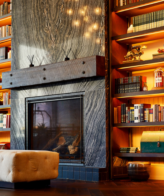 a fireplace and bookshelf