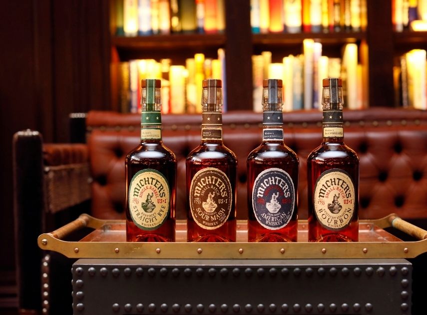 a row of bottles of liquor on a tray