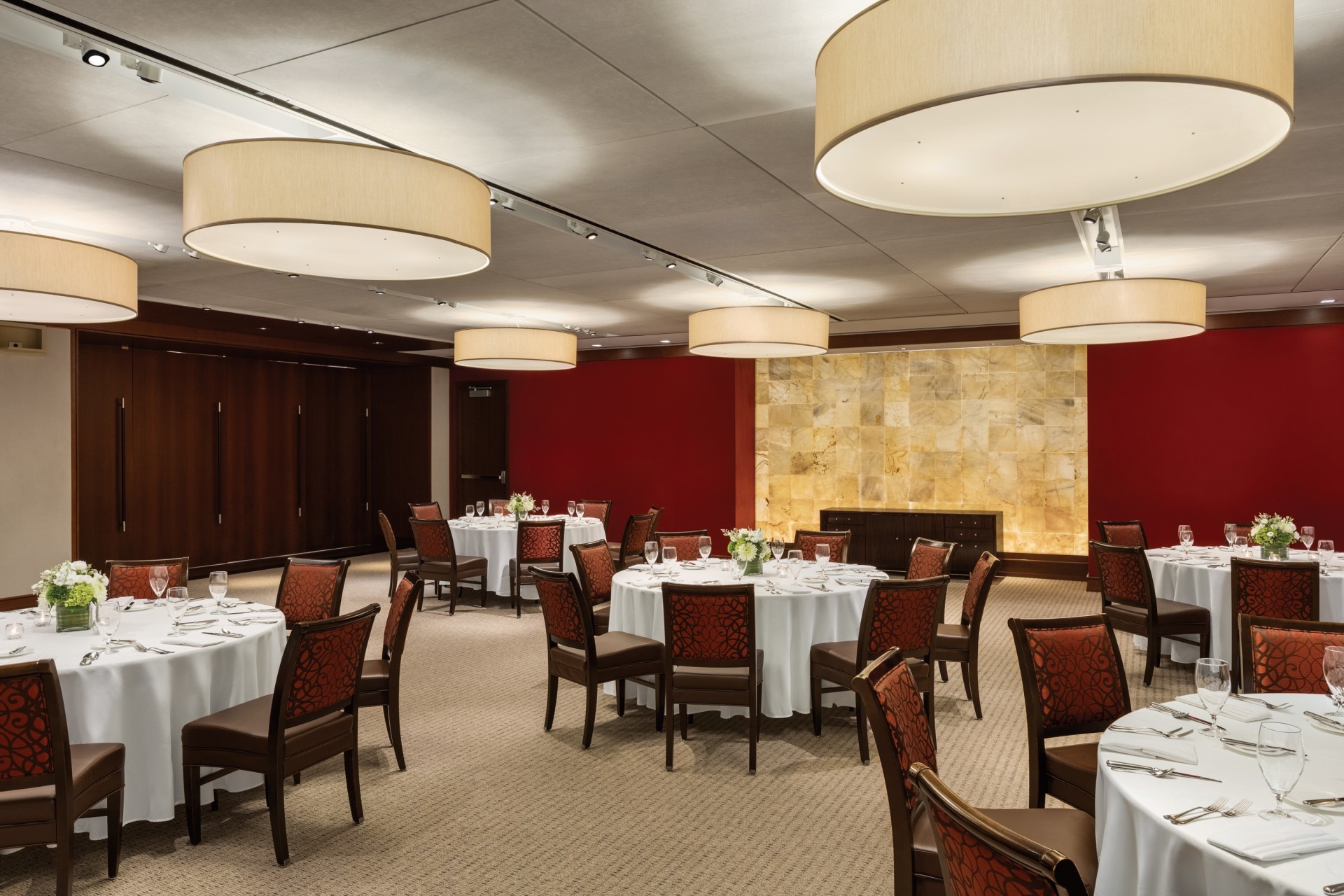 a room with round tables and chairs