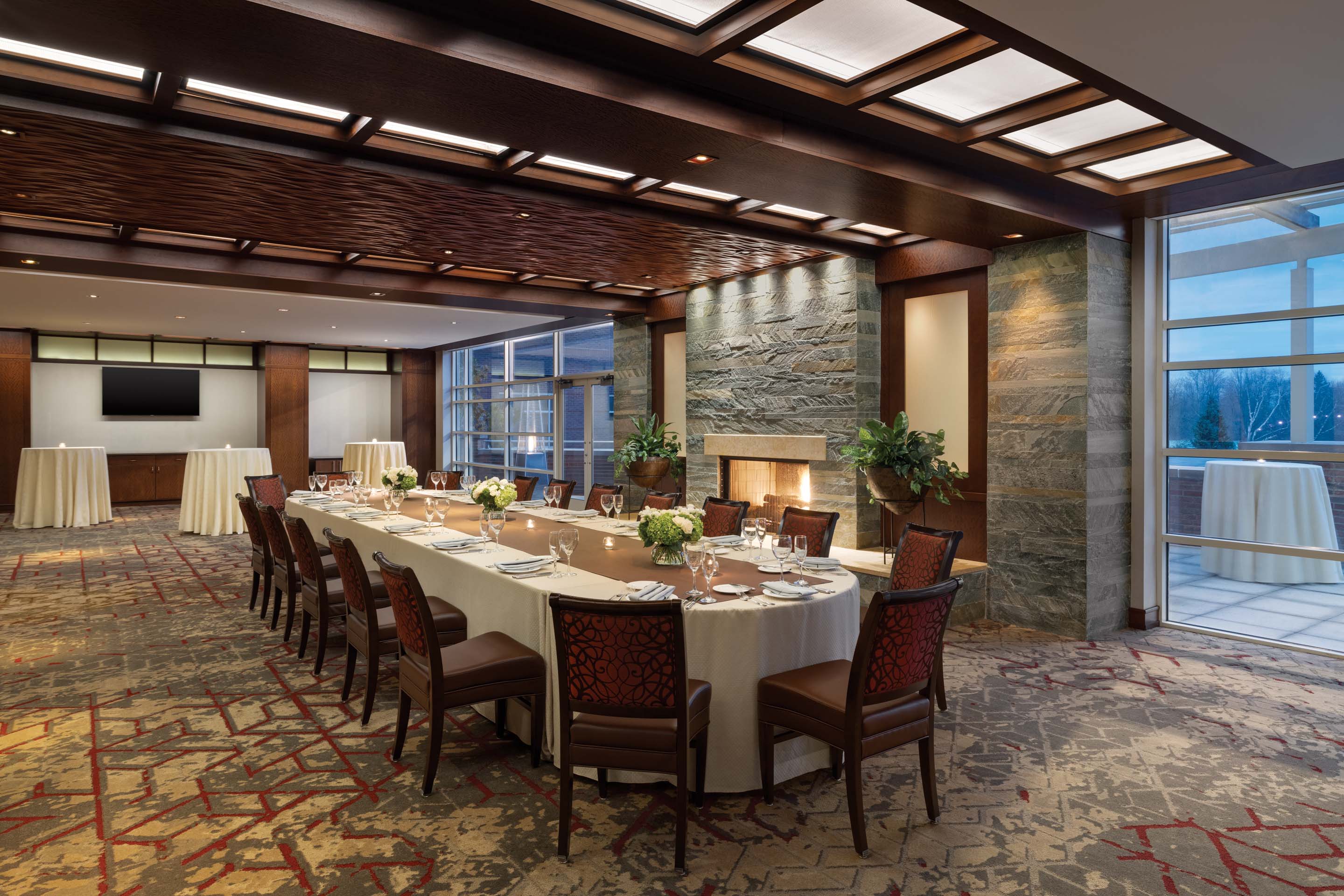 a large room with a long table and chairs