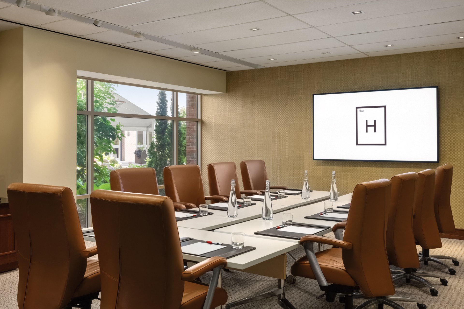 a conference room with a large table and chairs