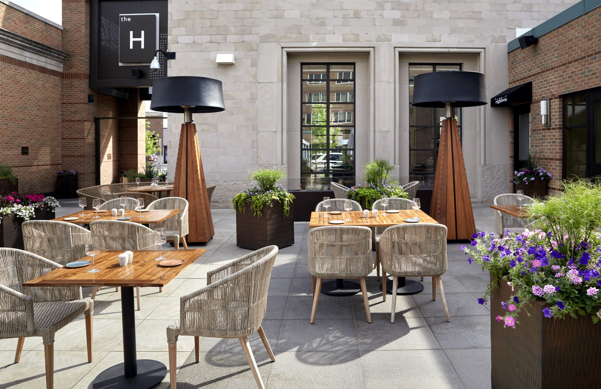 a patio with tables and chairs