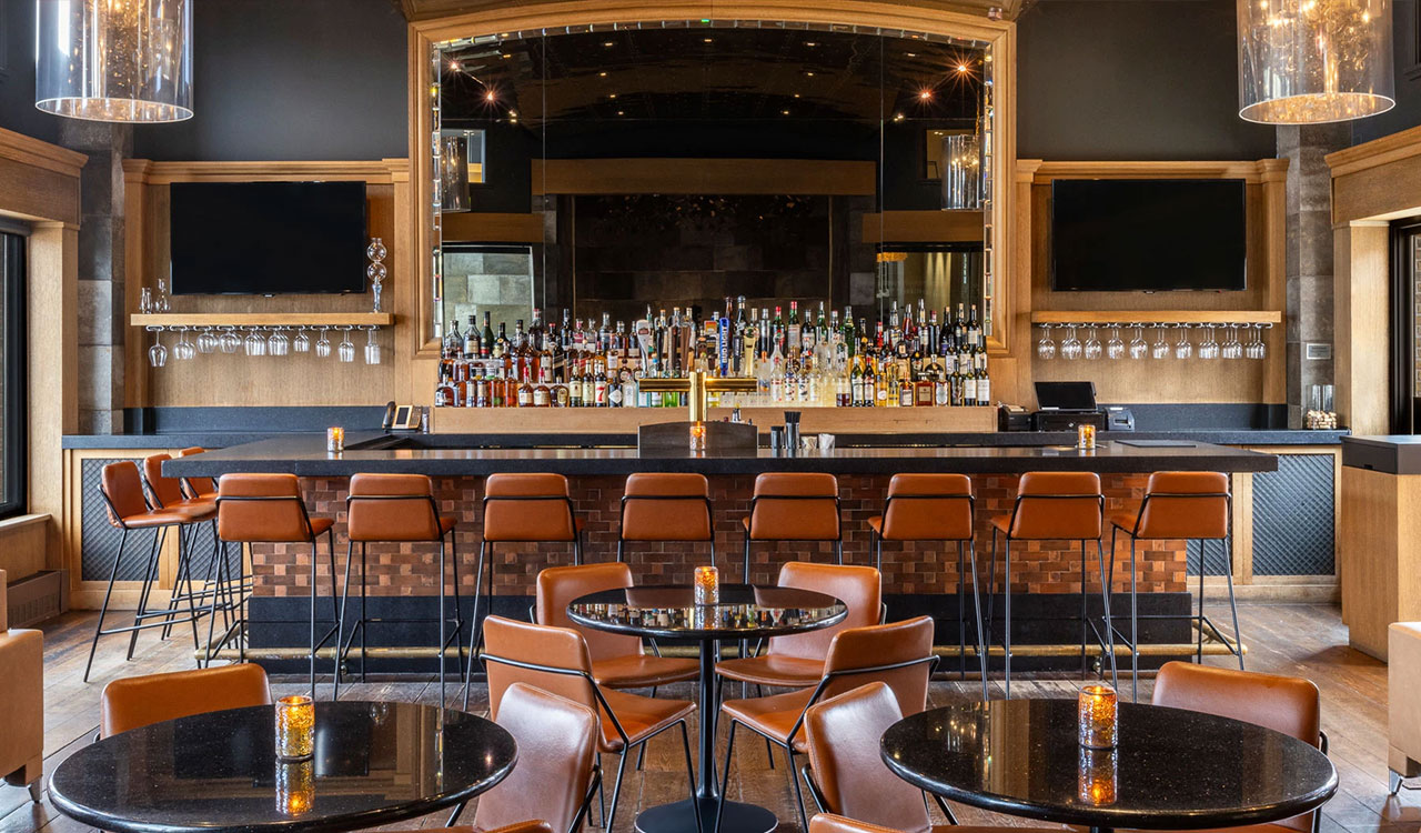 a bar with many bottles of alcohol