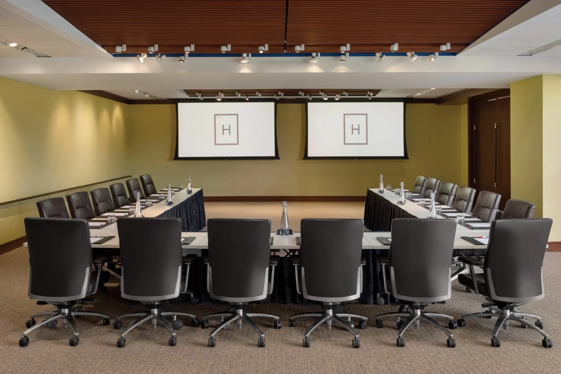 a conference room with a table and chairs