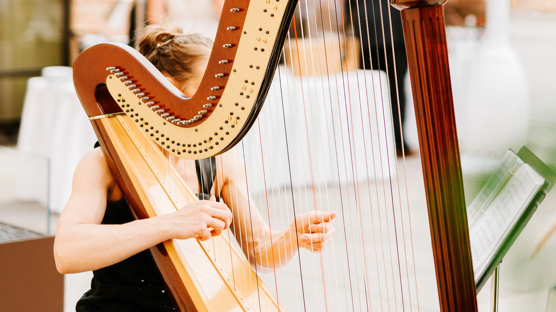 a woman playing a harp