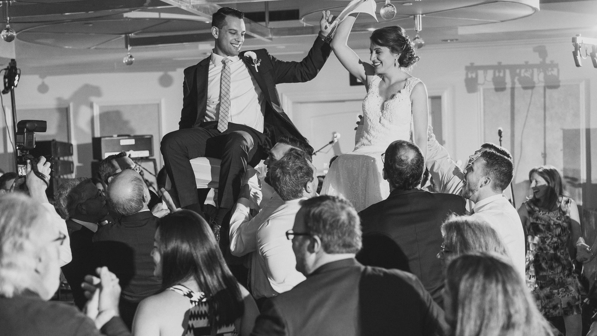 a man and woman sitting on a chair