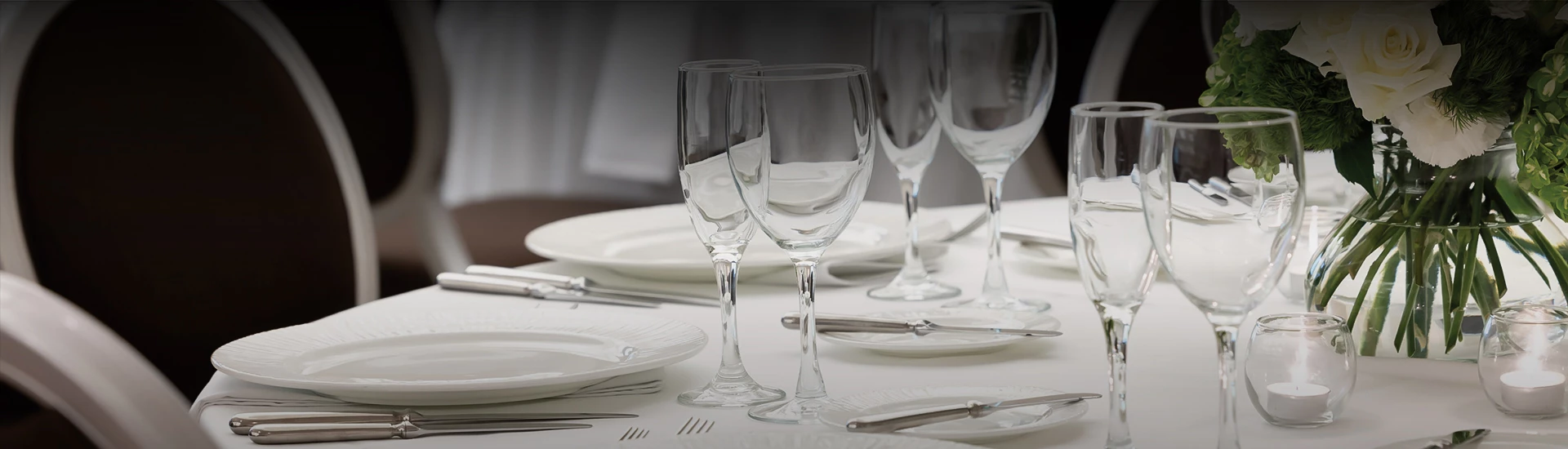 a group of wine glasses on a table