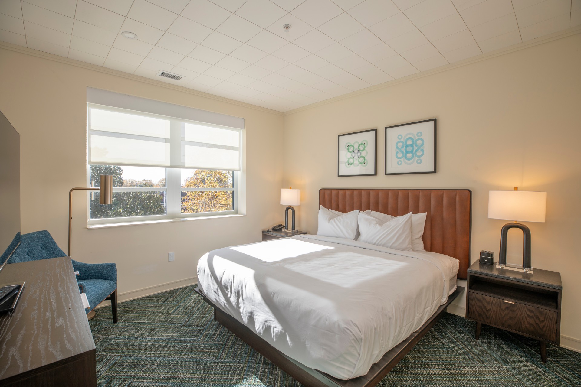 a bedroom with a bed and a chair