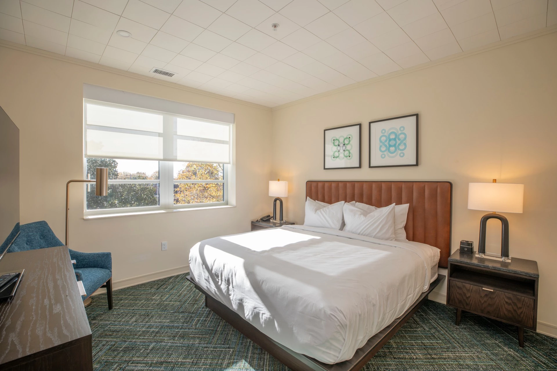 a bedroom with a bed and a chair