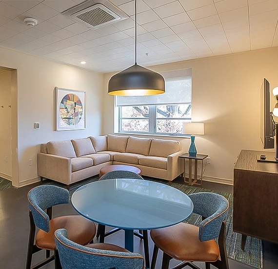 a living room with a couch and a table