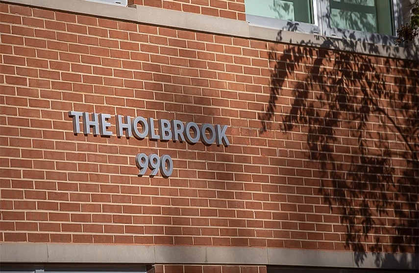 a sign on a brick wall