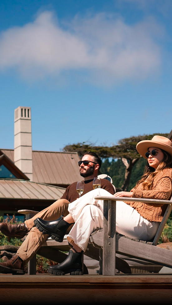 a man and woman sitting on a bench