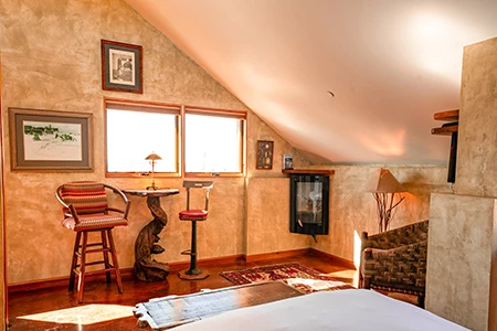 a room with a bed and a fireplace