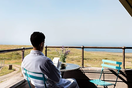 a man sitting at a table with a book