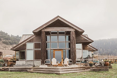 a house with chairs on the porch