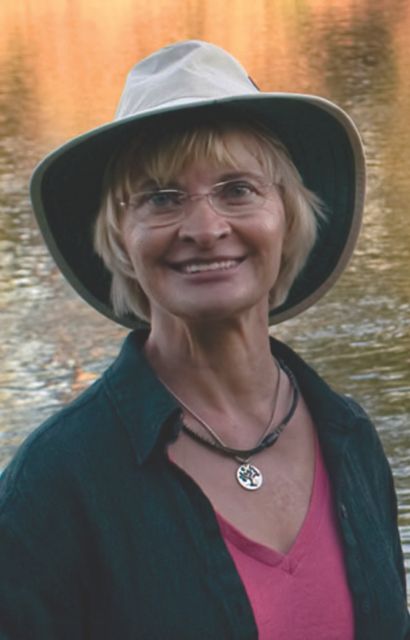 a woman wearing a hat and glasses