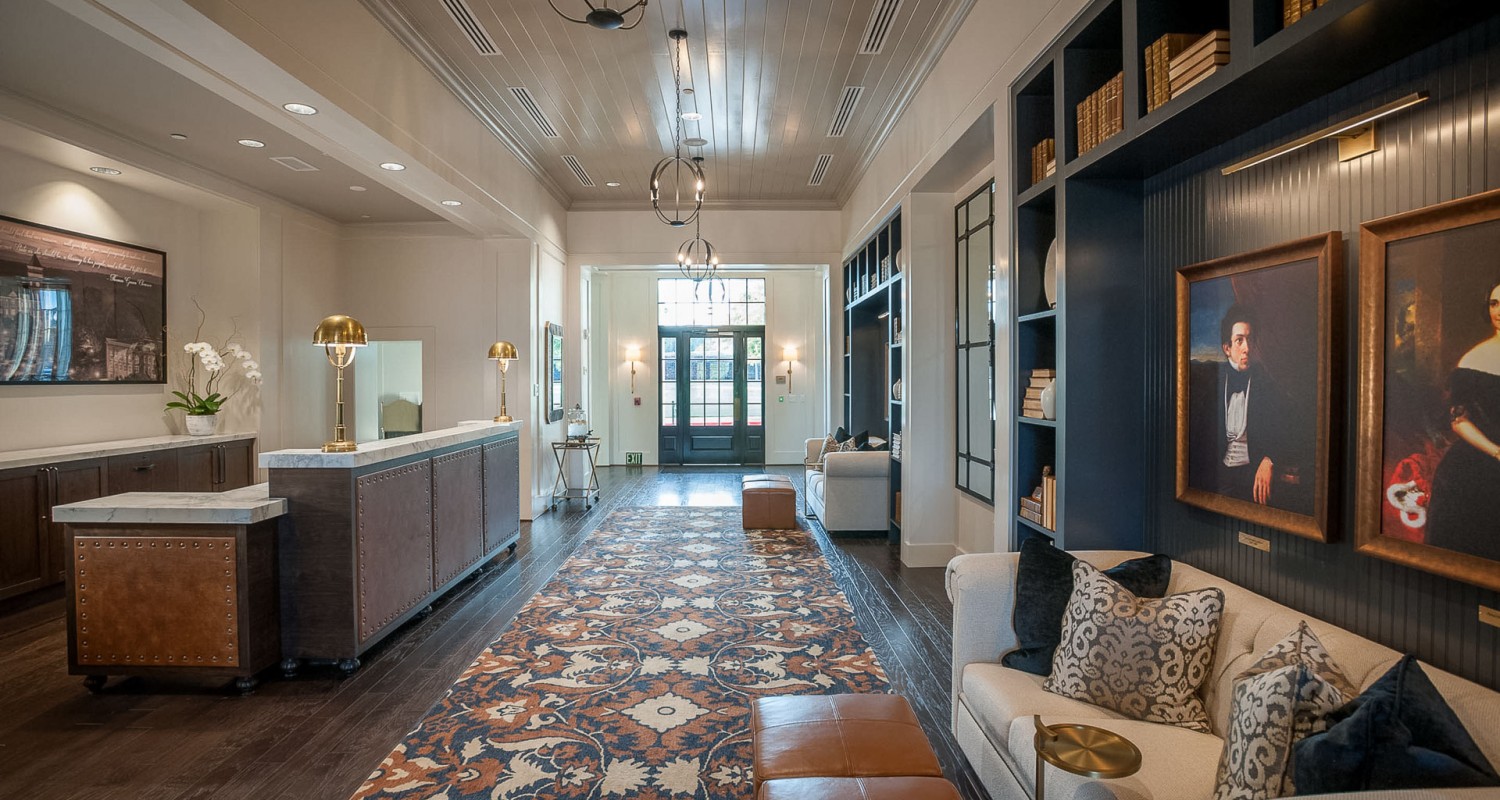 a room with a rug and a couch