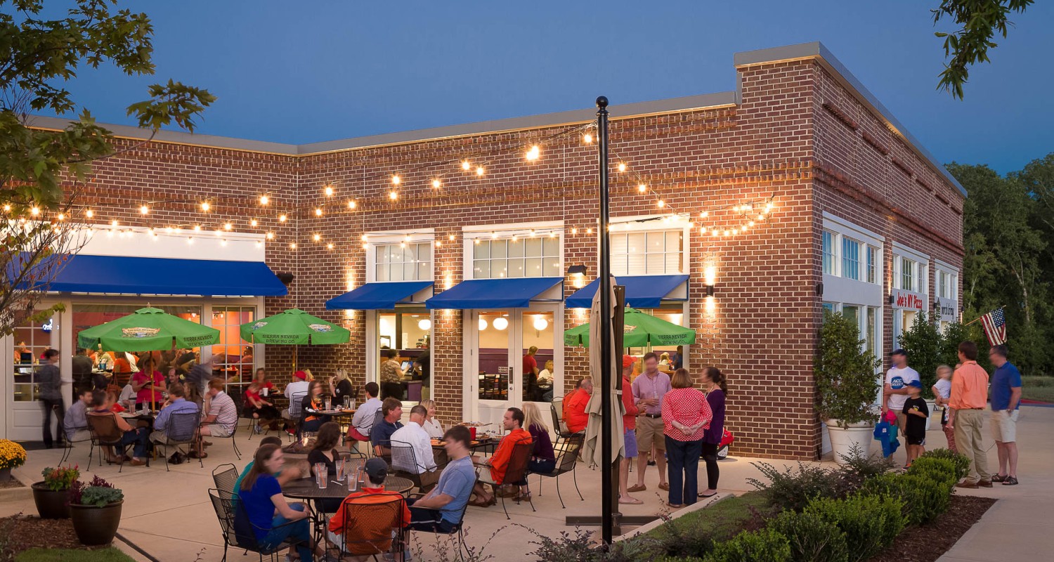 a group of people sitting outside a building