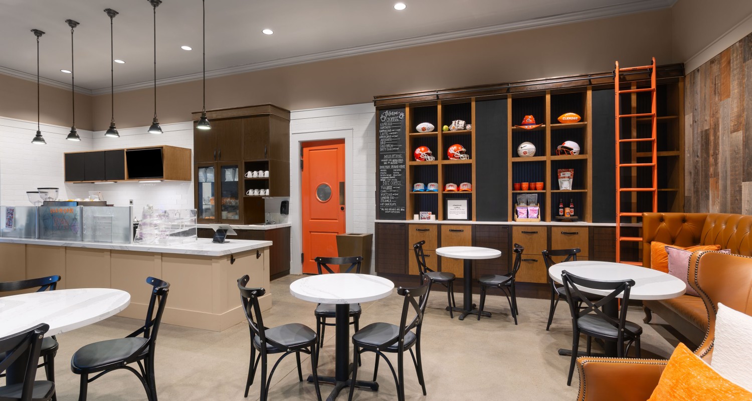 a coffee shop with tables and chairs
