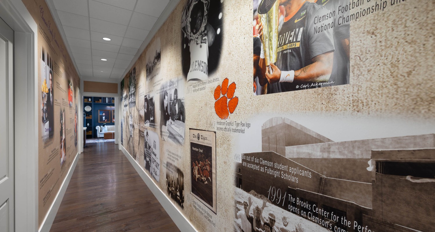a hallway with pictures on the wall