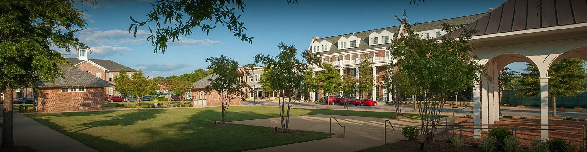a building with trees and grass