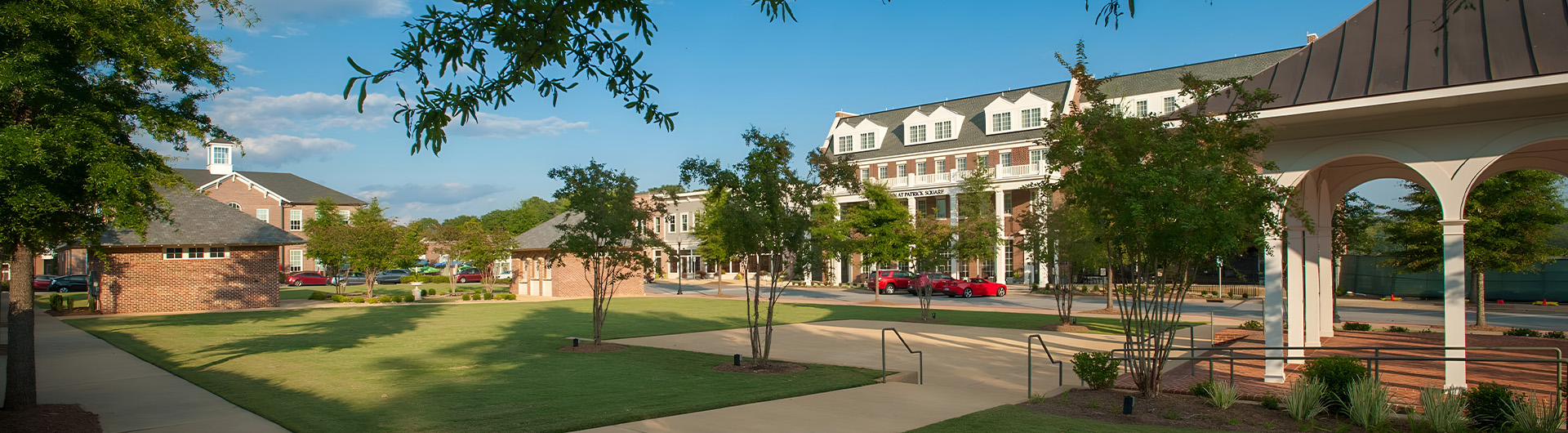 a building with trees and grass