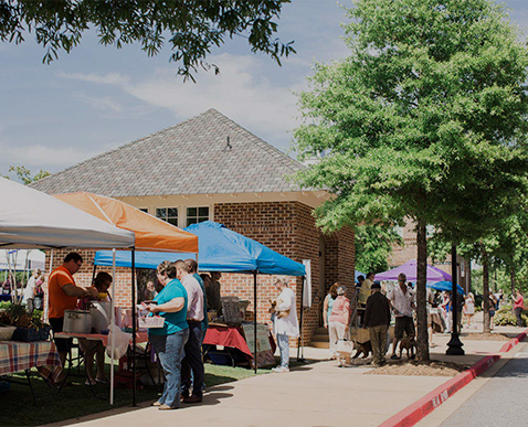 a group of people at a street market