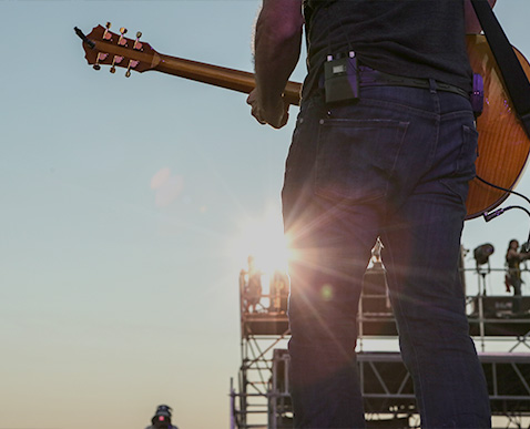 a man holding a guitar