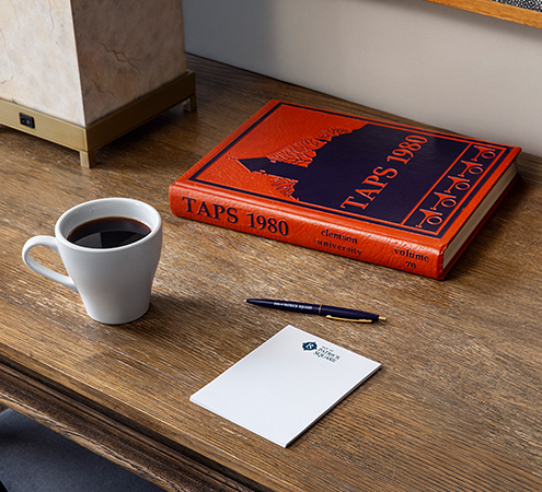 a book and a cup of coffee on a table