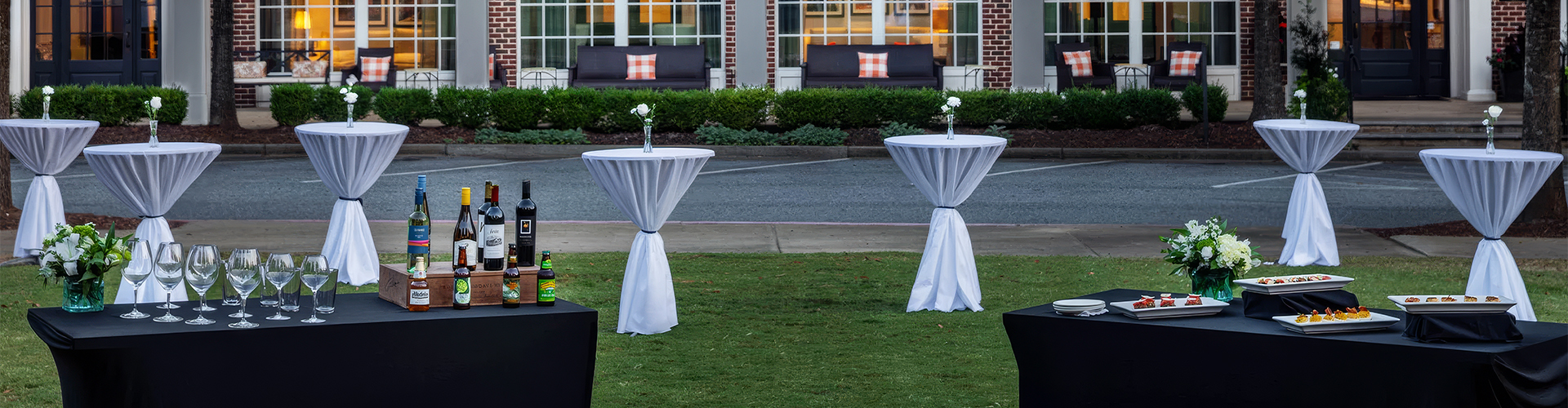 tables on the grass with white cloth