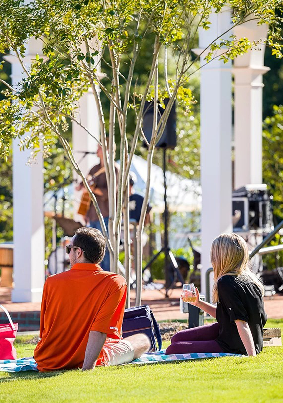 a man and woman sitting on a bench