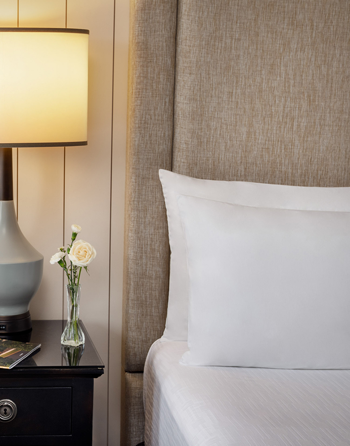 a white pillow on a bed